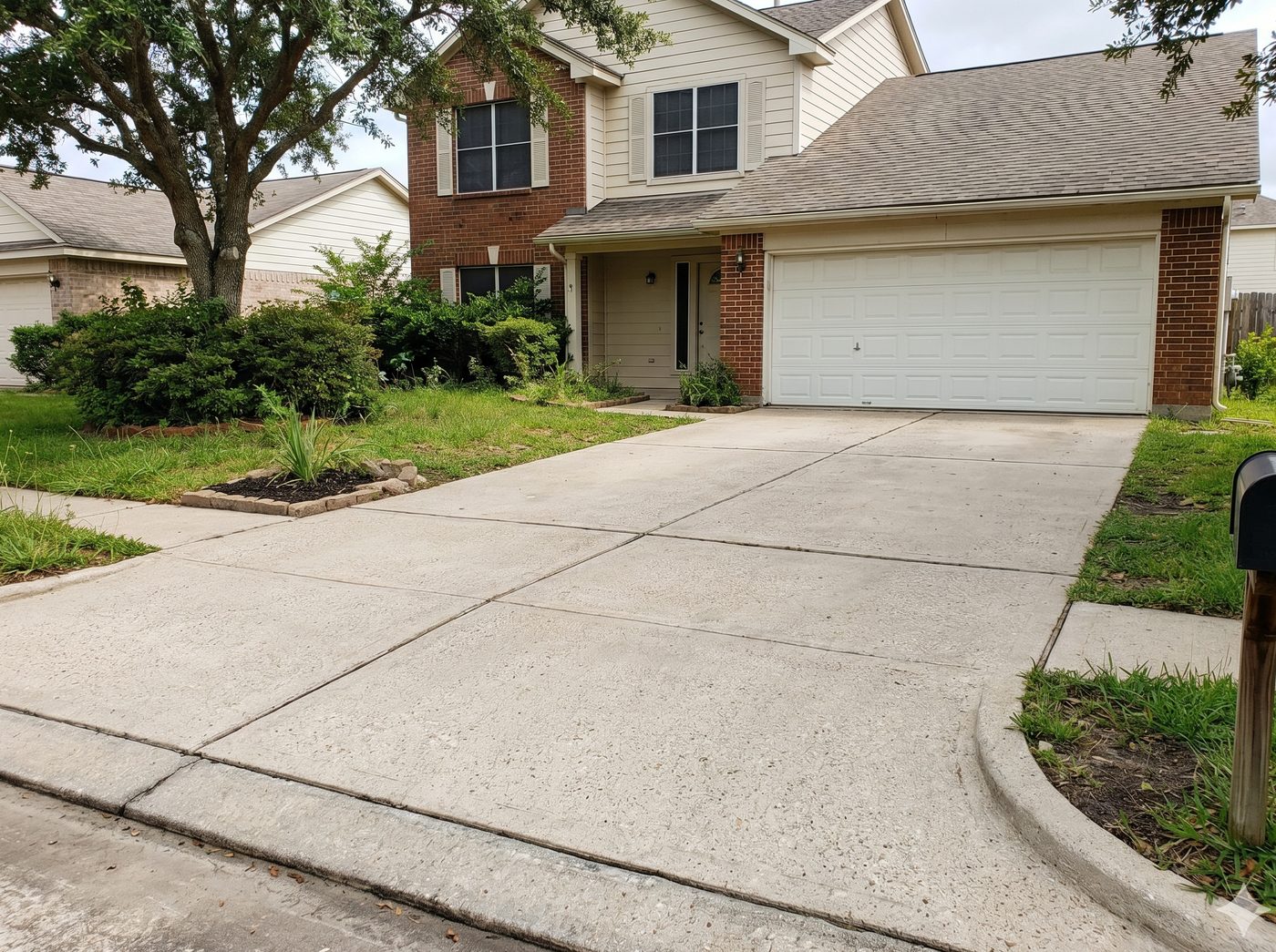 Concrete driveway after pressure washing — clean