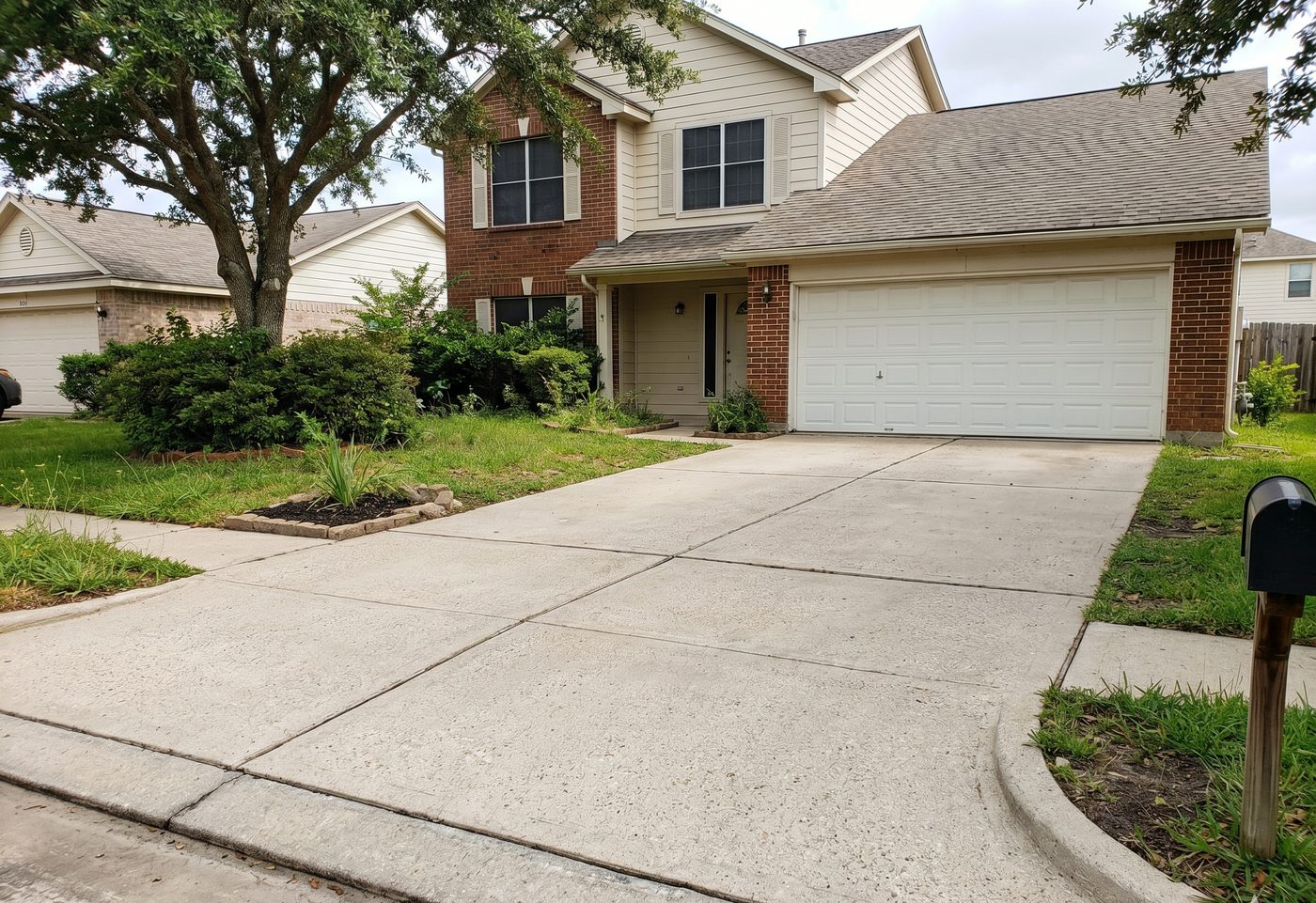 Freshly pressure-washed concrete driveway