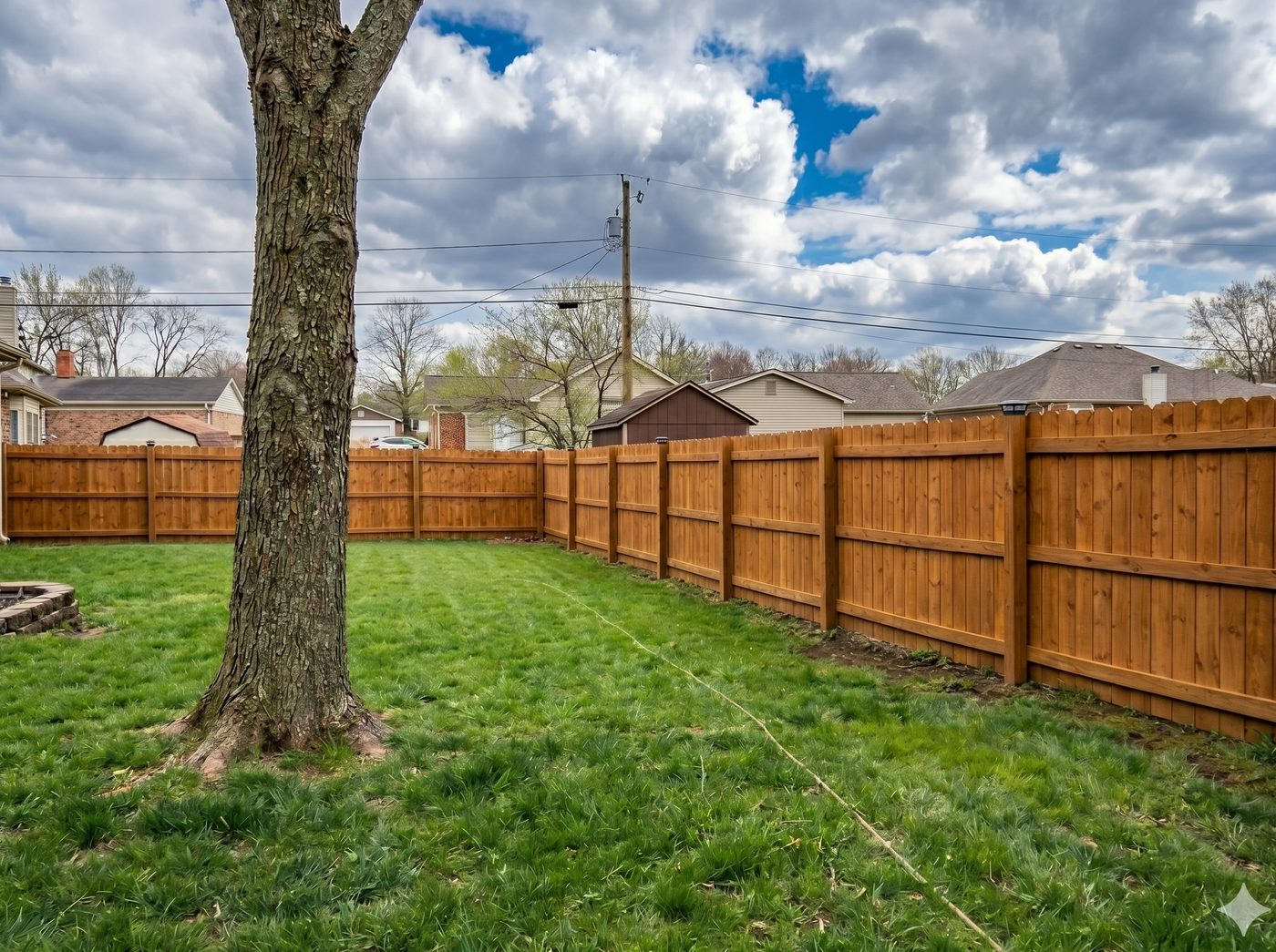 Wood fence after cleaning — bright and restored
